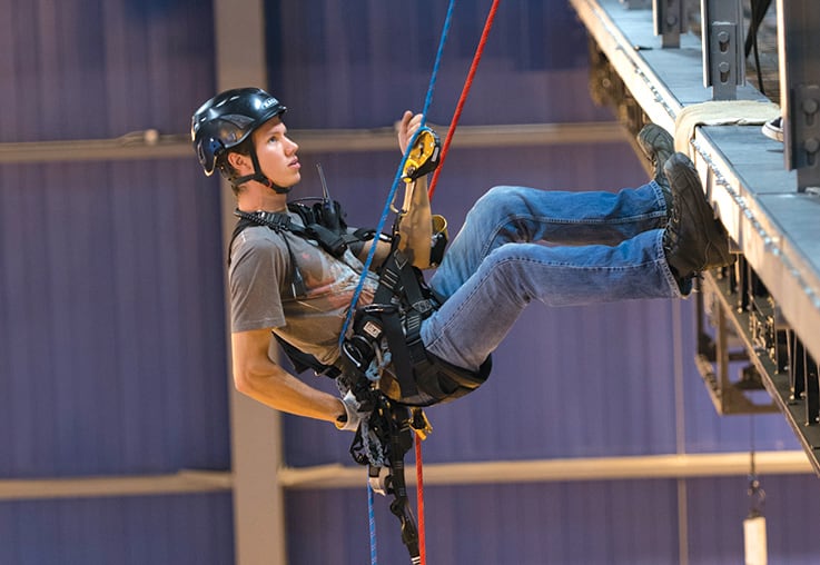 Man attached with harness