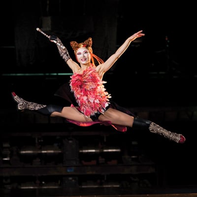 Dancer hops and glides through the air during an acrobatic act - Kà show Las Vegas