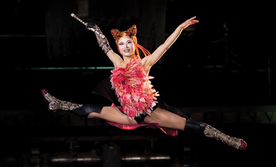Dancer hops and glides through the air during an acrobatic act - Kà show Las Vegas