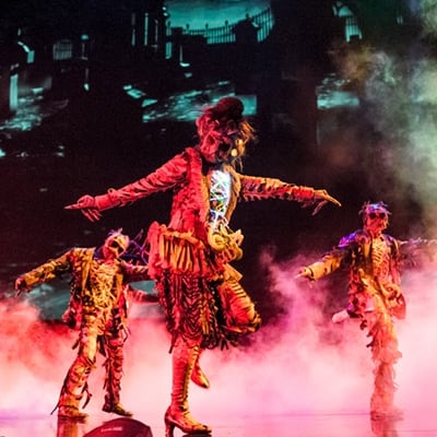 Zombie horde is dancing with open arms in a foggy environment - Michael Jackson One by Cirque du Soleil